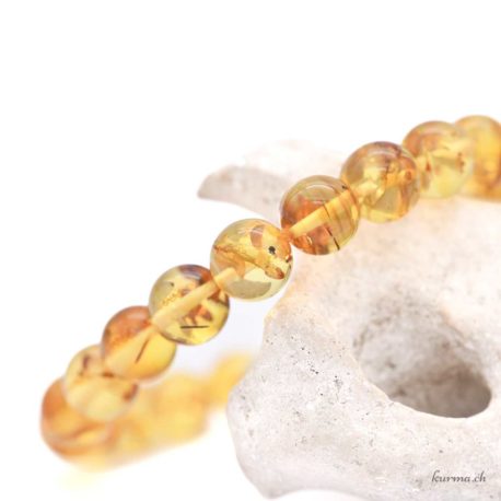 Acheter Bracelet Ambre Claire 8mm - N°9025.170-3 dans la boutique en ligne Kûrma. Magasin suisse de pierre de qualité.