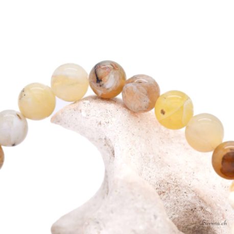 Acheter Bracelet Opale Jaune perles 8mm - N°16139-2 dans la boutique en ligne Kûrma. Spécialisé dans des pierres de qualité directement importer depuis les artisans lapidaires.